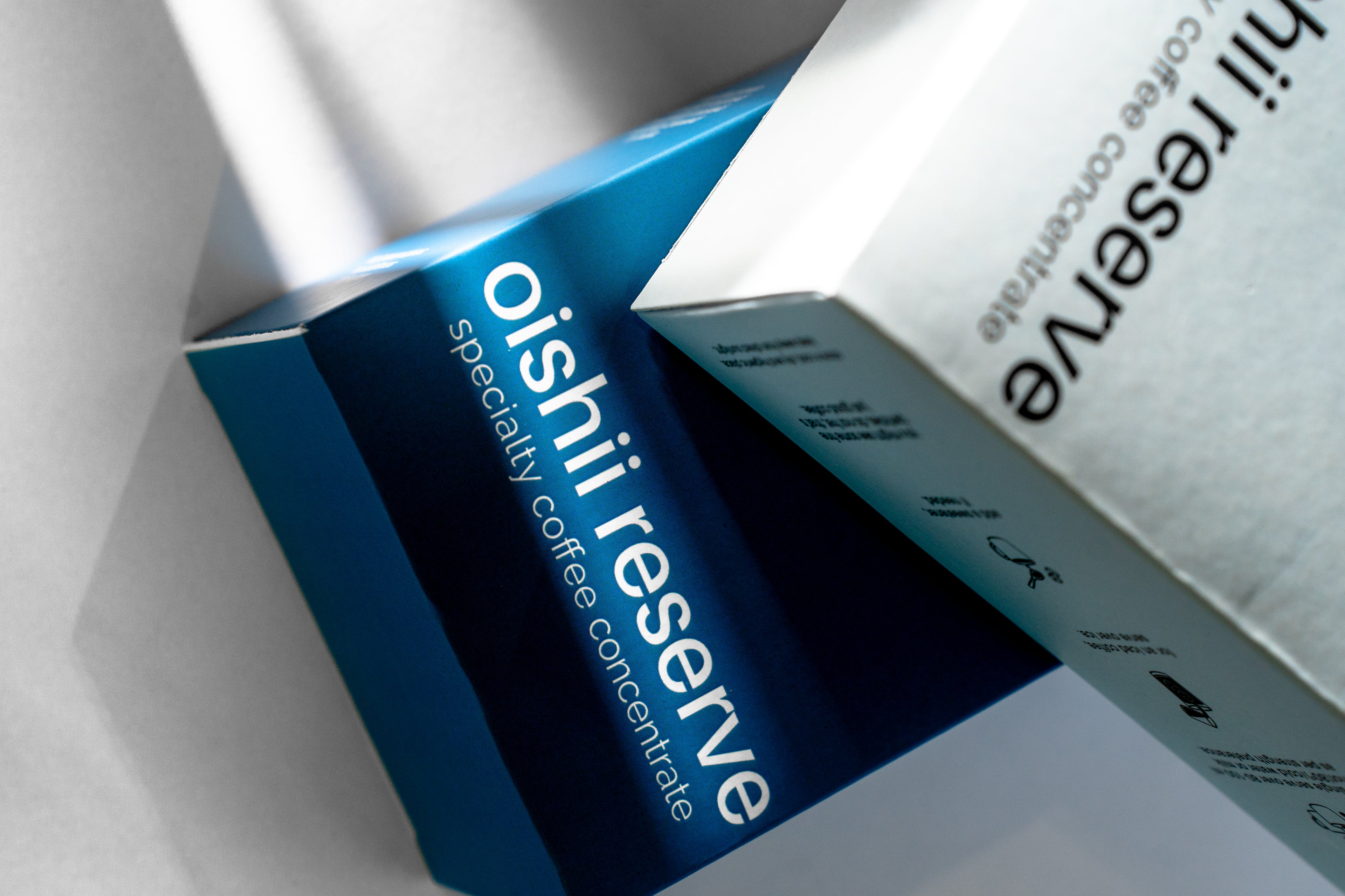 Oishi Reserve specialty coffee concentrate packaging on a white background